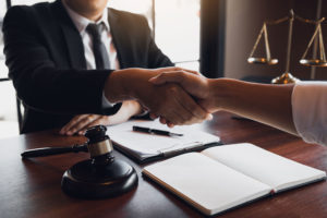 lawyer shaking hands with the client